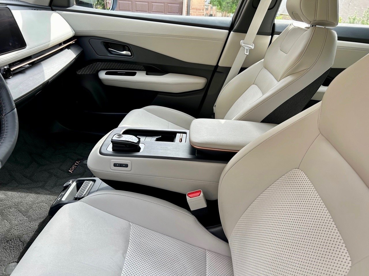 2023-Nissan-Ariya-Empower-Plus-front-row-console-carpro.