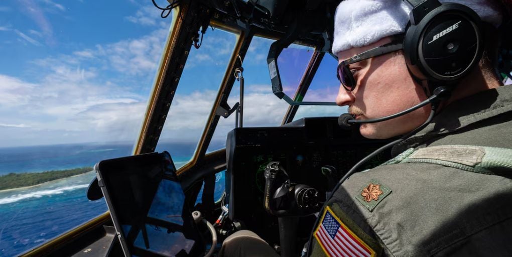 Air Force Maj. Chase Hessman, instructor pilot assigned to the 36th Airlift Squadron at Yokota Air Base, Japan, flies a C-130J Super Hercules toward Fassari, Micronesia, Dec. 10, 2024, during Operation Christmas Drop. Photo Credit: Air Force Senior Airman Natalie Doan/U.S. Dept. of War.