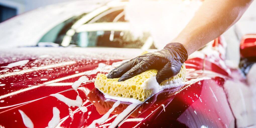 Man washing a car 5 Ways To Maintain Your Car’s Value CarPro.com