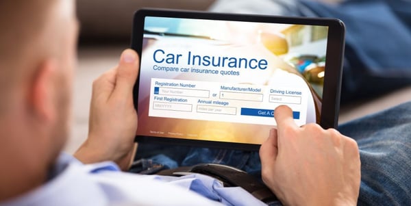 car-insurance-shopping-laptop-Photo Credit Andrey_PopovShutterstock