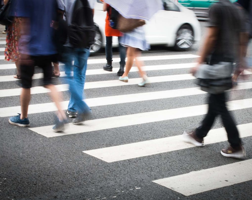 pedestrians crossing a crosswalk