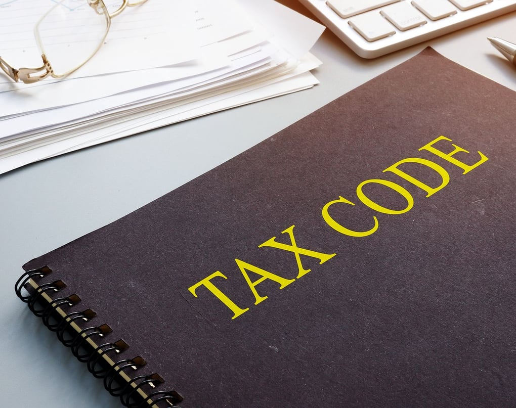 TAX CODE book on a desk