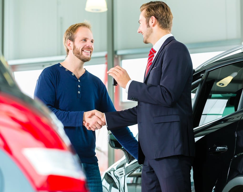 Shutterstock image of guy with car salesperson