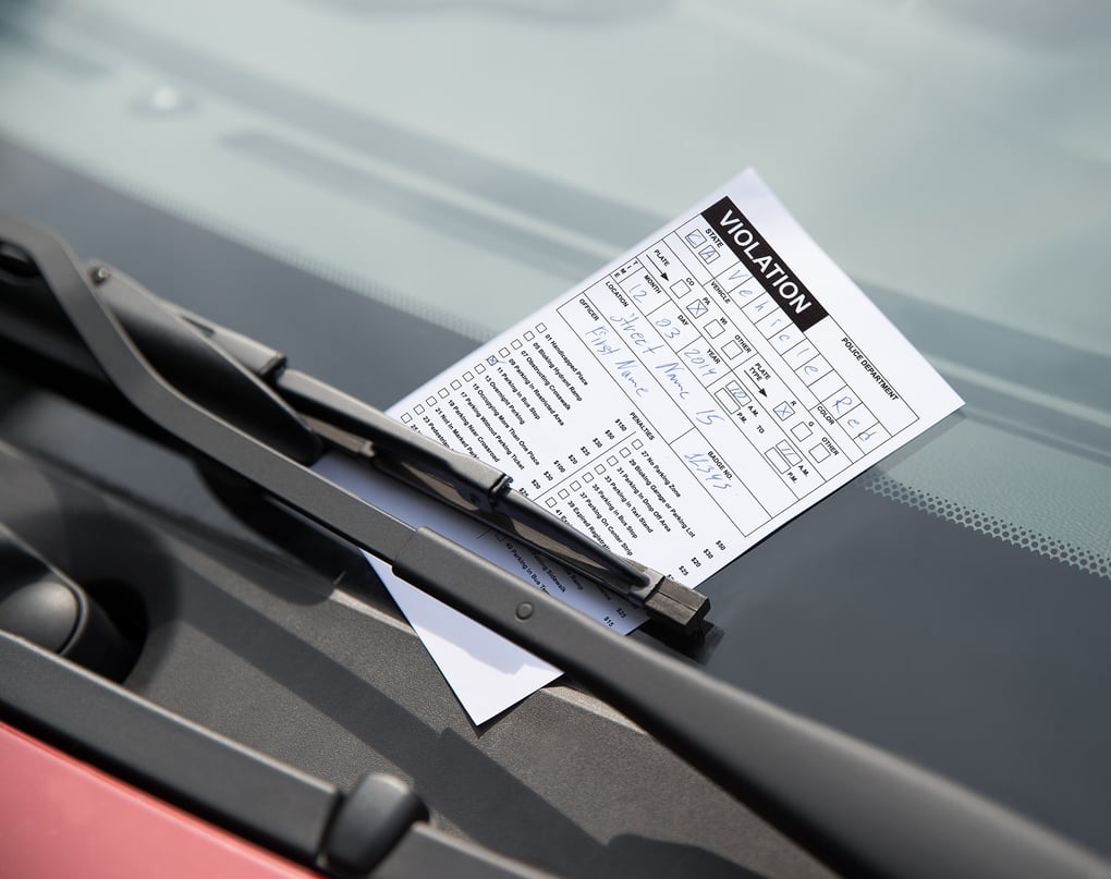 Parking ticket on car windshield. Photo Credit: Andrey_Popov/Shutterstock.