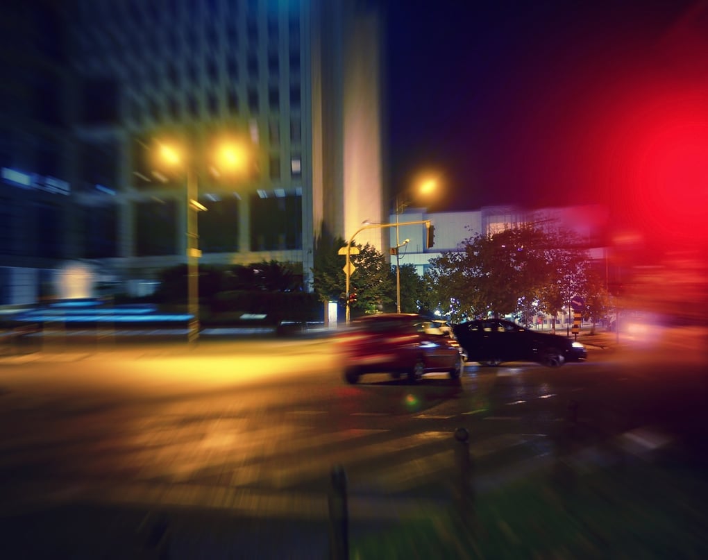 Cars on street at night